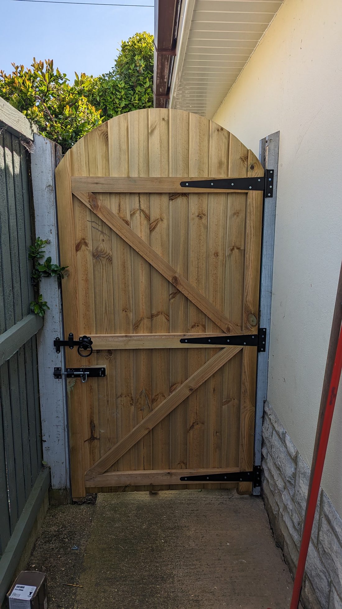 New arched-top timber side gate with black hinges